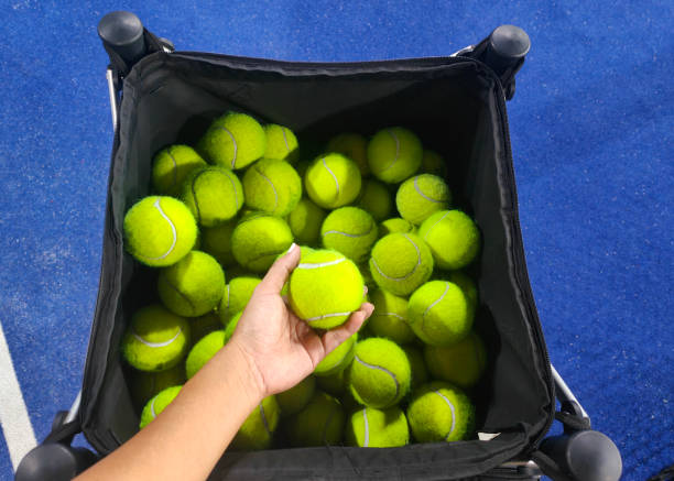 Close-up shot of Unrecognizable Hand Holding Padel Balls