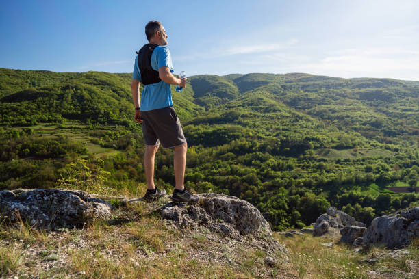 istock Trail runner at the top of the mountain 2148379062