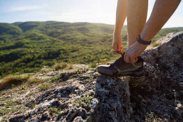 istock Trail runner preparing for a sports training on a rocky mountain trail 2148379111