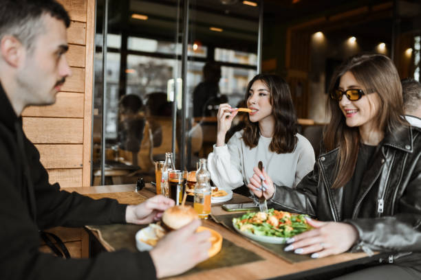 istock Food Tasting Time For Smiling Friends 2148379120