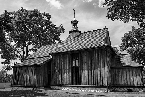 The wooden, historic parish church of St. Giles in the village of Zrebice, Poland