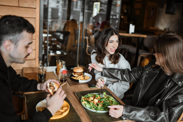 istock Lesbian Couple Trying Each Others' Food 2148379285