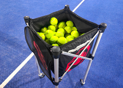 Close-up shot of  Padel Balls Inside Wheeled Bag Basket