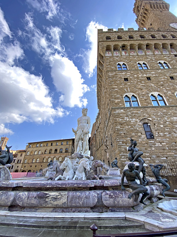 Famous Neptune Fountain on Piazza della Signoria with Palazzo Vecchio in Florence, Italy.