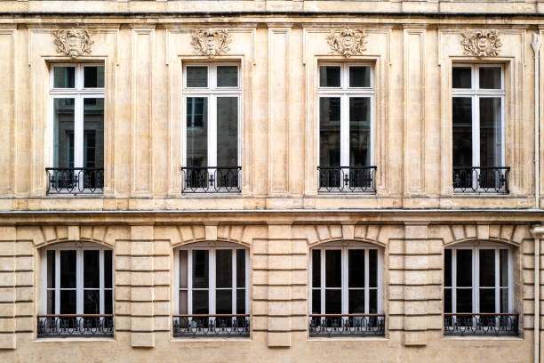 red brick exterior of queens pavilion on historic place des vosges or vosges square in marais district of paris