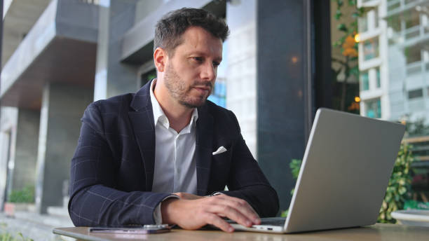istock Successful businessman work at cowork cafe. Business man type computer mackbook. 2148382715