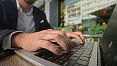 Entrepreneur type computer keyboard closeup. Businessman work laptop macbook.