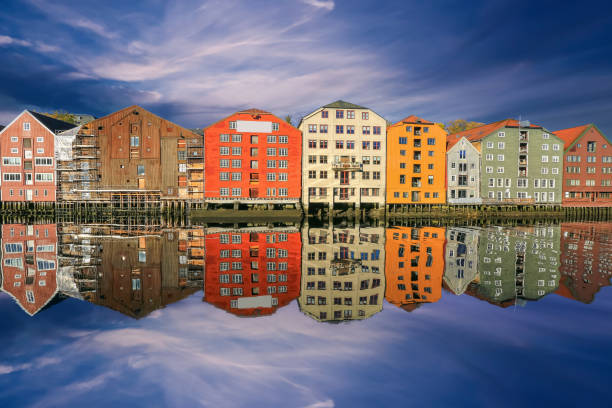 Autumn in Trondheim, view of the river Nidelva and historical timber buildings Bryggeri along the river in the Norwegian city Trondheim