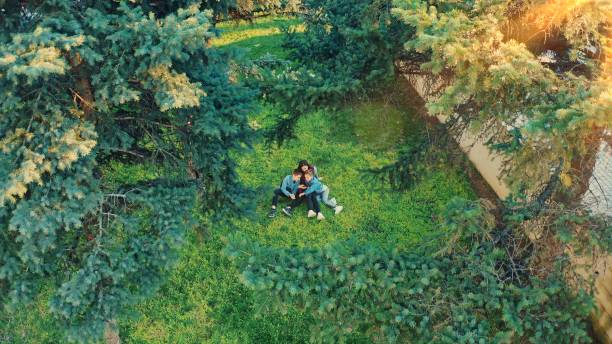 Woman with two children in a park from a drone flight