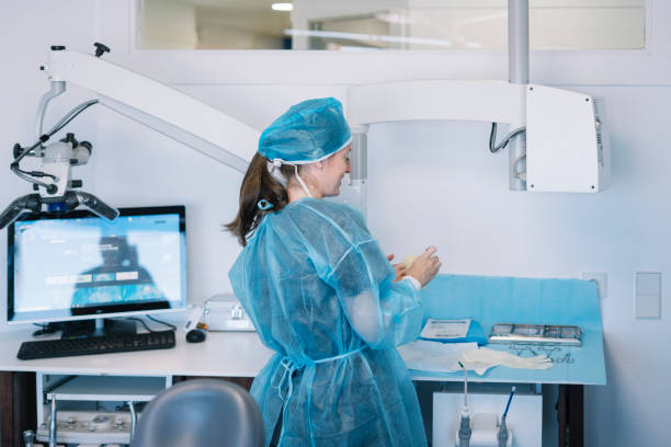 istock Female dentist working in the clinic 2148384110