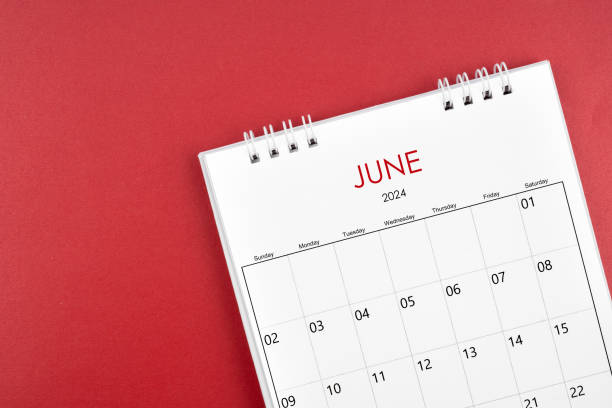 istock June 2024 desk calendar on red background. 2148385411