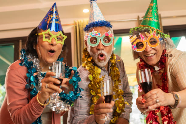 istock Old friends enjoying drinks at house party 2148385439