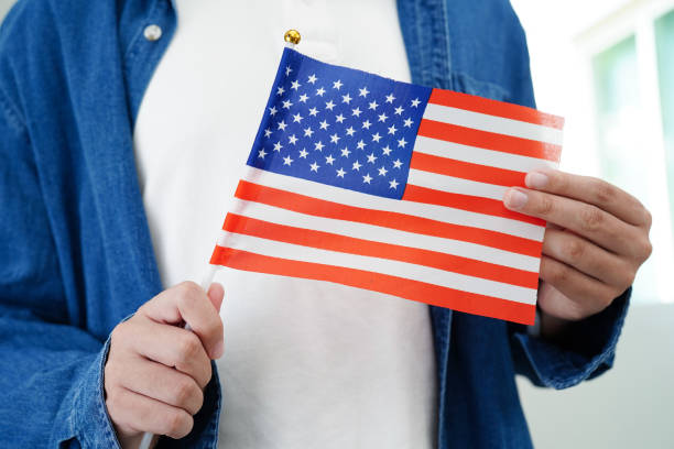 istock Learning English, Asian teenage student holding flag for language program education. 2148385455