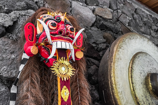Close up photo of Traditional Leak Rangda Mask costume for a Bali Dance theater performance. Handcrafted masks in the form of legendary demons in Bali, Indonesia.
