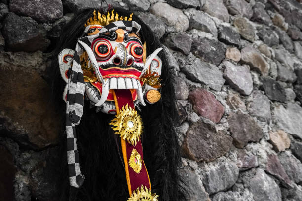 close up photo of traditional leak rangda mask costume for a bali dance theater performance. handcrafted masks in the form of legendary demons in bali, indonesia. - rangda стоковые фото и изображения