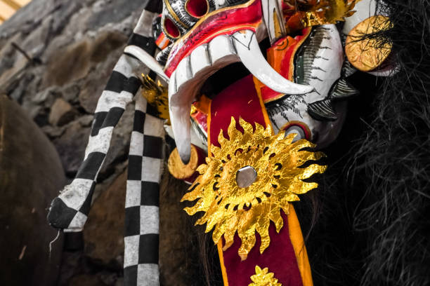 close up photo of traditional leak rangda mask costume for a bali dance theater performance. handcrafted masks in the form of legendary demons in bali, indonesia. - rangda стоковые фото и изображения