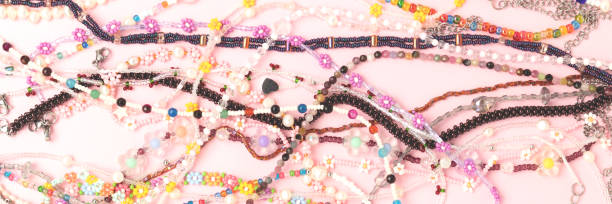istock Banner with chains of beads, pearls and natural stones. 2148385884