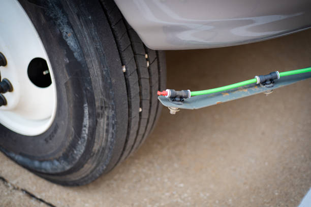 istock Spray nozzle water system on front of street sweeper road cleaner truck with hydrant coupling, fill hose, electric diaphragm pump, flow control valves spraying cleaning highway and urban roads 2148385916