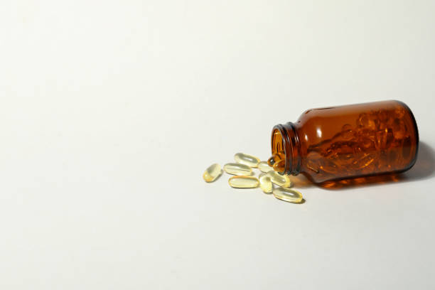istock Brown bottle with omega pills on white background 2148386135