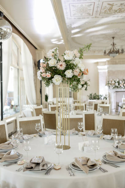 istock Elegant wedding reception venue with sophisticated decor and floral arrangements 2148386151