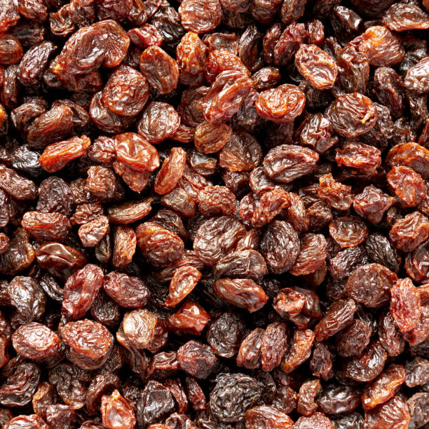 istock Dried Brown Raisins, top view. Flat lay, overhead, from above. Close-up. 2148388282