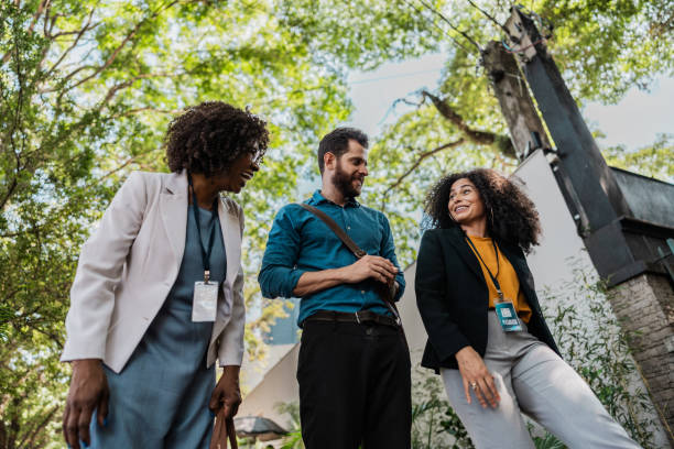 istock Coworkers talking while walking in the street 2148389218