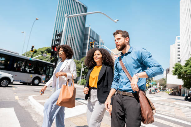 istock Coworkers talking while walking in the street 2148389285