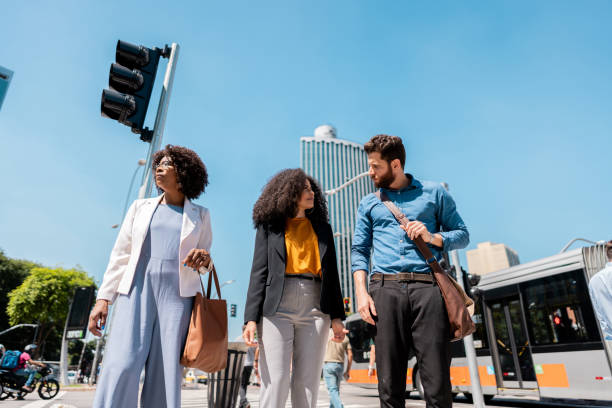 istock Coworkers talking while walking in the street 2148389286