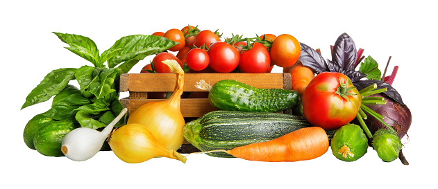 Fresh vegetables harvest in basket. Organic food Isolated on white background.