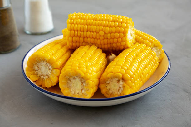 istock Homemade Steamed Corn on the Cob with Butter on a Plate, side view. 2148389830