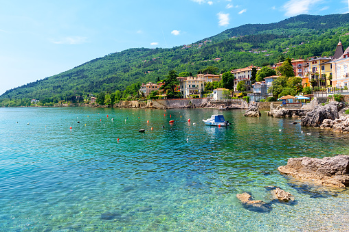 Beautiful coastline with boat and rocks in Lovran, Istria, Croatia