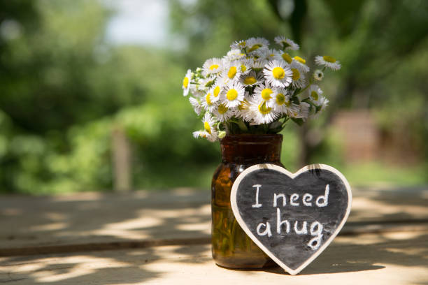 istock I need a hug hand drawing phrase on a heart, Sharing a Hug concept 2148390091