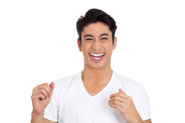 Closeup portrait of handsome, laughing successful young man, student isolated on white background