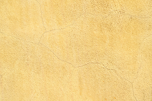 Old yellow grunge background texture wall