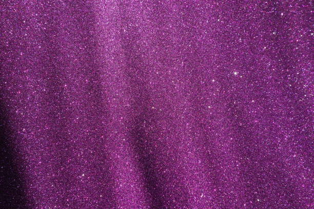 istock Oblique rays of light on a purple lilac surface. Bokeh, dust particles, reflection magical glow. Festive shining background. New Year, Christmas, birthday. Plastic card design. Cosmic photons space. 2148391529