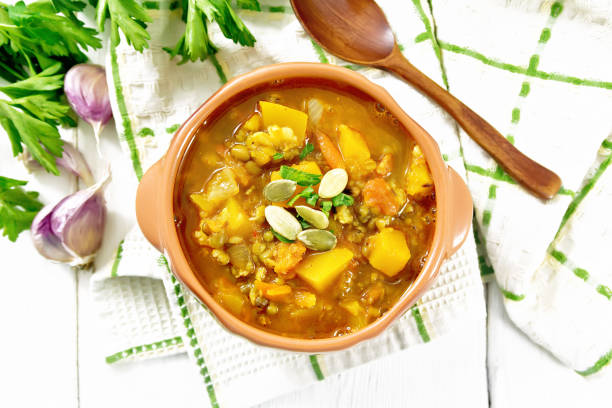 istock Soup-curry with pumpkin and lentils in bowl on light board top 2148391653