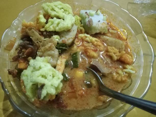 istock chicken soup mixed with lontong and topped with crackers 2148391656