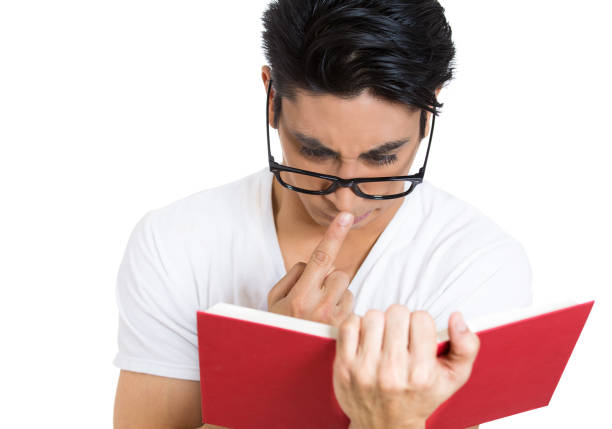 older man reading in his living room