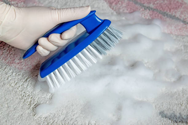 istock Blue brush on the floor with hand in rubber glove. Cleaning. 2148392013