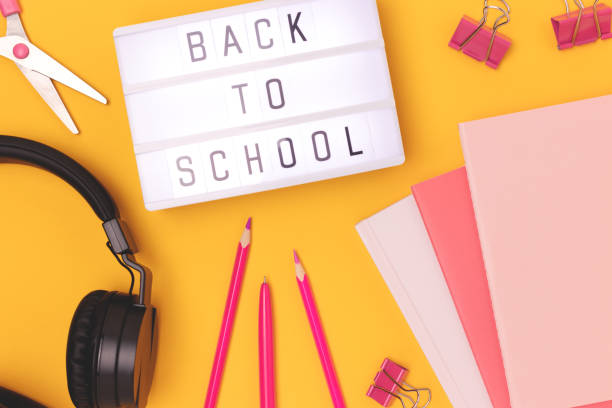 istock Back to school. Lightbox with letters, headphones and stationery. 2148392107