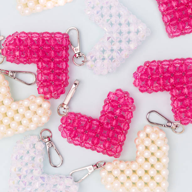 istock Different handcraft keychains in a heart shape made from acrylic beads. 2148392171