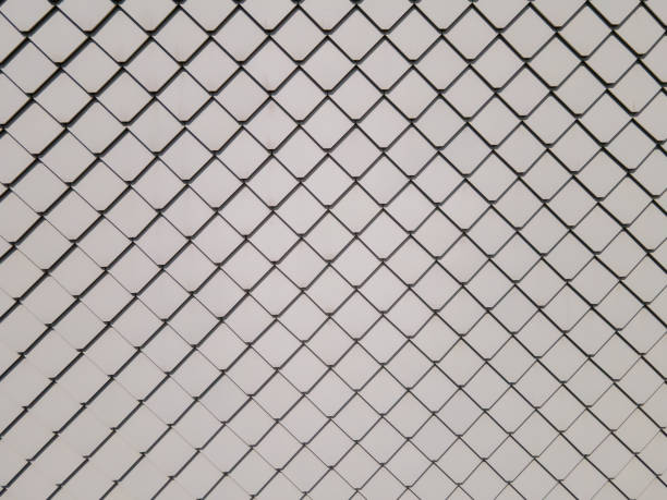 Pattern of white diamond-shaped roof tiles. Abstract.