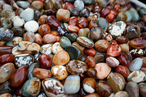 Assorted colorful polished quartz mineral stones. Decoration background