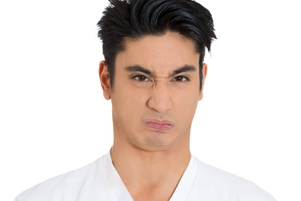 portrait of a disgusted annoyed young man