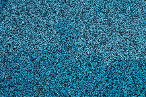 Blue and black rubber ground texture for playground protection