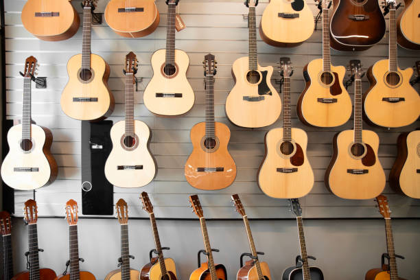 istock classic musical guitar instruments on display in a music shop. 2148393104