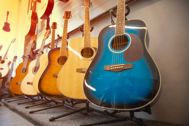 istock Guitars on sale. Stack of musical instruments . 2148393108