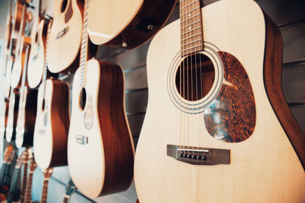 istock Group of classic musical guitar instruments . Side View of Guitar at Display Rack 2148393113