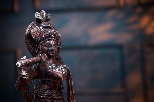 Close-up of a brass pooja bell in use during a pooja during a South Indian Hindu wedding ceremony.