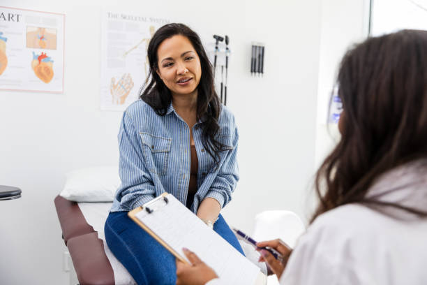 istock Unrecognizable female doctor talks with her female patient 2148393418